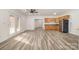 Open-concept living space with French doors and hardwood floors at 6823 Manatee Dr, Concord, NC 28025