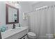 Cozy bathroom featuring a single vanity and shower with curtain at 6908 Beamish Pl, Mint Hill, NC 28227