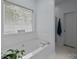 A bright bathroom features a soaking tub below a window and a separate shower at 6908 Beamish Pl, Mint Hill, NC 28227