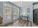 Dining area featuring hardwood floors, a window, glass paneled door and a wooden table at 6908 Beamish Pl, Mint Hill, NC 28227