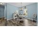 Charming dining area features hardwood floors, natural light, and comfortable seating at 6908 Beamish Pl, Mint Hill, NC 28227