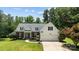 Charming brick and siding home with a well-manicured lawn, two-car garage, and inviting curb appeal at 6908 Beamish Pl, Mint Hill, NC 28227