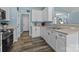 Bright kitchen featuring stainless steel appliances and wood floors at 6908 Beamish Pl, Mint Hill, NC 28227