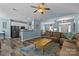 Open-concept living room, connecting kitchen, dining, and living areas, with hardwood floors and neutral tones at 6908 Beamish Pl, Mint Hill, NC 28227