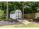Backyard shed with double doors and a concrete path adds functional storage to the property at 6908 Beamish Pl, Mint Hill, NC 28227