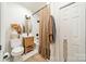 Stylish bathroom with wood vanity, tub-shower combo, and decorative accents at 7901 Bud Henderson Rd, Huntersville, NC 28078
