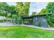 View of backyard chicken coop and run, with a table and chairs outside at 7901 Bud Henderson Rd, Huntersville, NC 28078