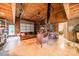 The spacious garage is paneled in wood, furnished with a sofa and shelves, and includes a wood-burning stove at 7901 Bud Henderson Rd, Huntersville, NC 28078