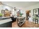 Stylish kitchen featuring a farmhouse sink, open shelving, an island, and wood floors, a chef's delight at 7901 Bud Henderson Rd, Huntersville, NC 28078