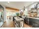 Modern kitchen with stainless steel appliances, open shelving, and a center island, perfect for cooking and entertaining at 7901 Bud Henderson Rd, Huntersville, NC 28078