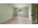 Bedroom with wood flooring, a window, and light green colored walls at 8019 Walnut Creek Ln, Charlotte, NC 28227