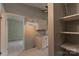 Bright kitchen features light wood cabinets, tiled floor, and leads into an adjoining room at 8019 Walnut Creek Ln, Charlotte, NC 28227