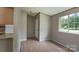 Bright room featuring hardwood floors, fresh paint, and natural light at 8019 Walnut Creek Ln, Charlotte, NC 28227