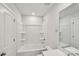 A bright, all-white bathroom features a shower-tub combo, toilet, and mirrored vanity at 908 Smithcliffs Trl, York, SC 29745