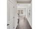 Hallway featuring hardwood flooring, neutral paint, and white trim at 908 Smithcliffs Trl, York, SC 29745
