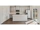 Modern kitchen featuring stainless steel appliances, gray cabinets, white countertops, and a large island at 908 Smithcliffs Trl, York, SC 29745