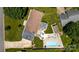 Aerial view highlighting a backyard featuring a pool, gazebo, and grassy area at 920 Thomas St, Statesville, NC 28677