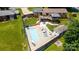 Aerial view of in-ground swimming pool surrounded by concrete decking at 920 Thomas St, Statesville, NC 28677