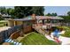 Multi-level deck and backyard with mature landscaping at 920 Thomas St, Statesville, NC 28677