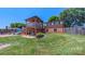 Expansive backyard featuring a spacious two-story deck with a play area and lush green lawn at 920 Thomas St, Statesville, NC 28677