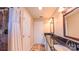 Bathroom features a double vanity, shower with curtain, and tile flooring at 920 Thomas St, Statesville, NC 28677