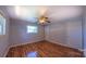 Neutral bedroom features laminate flooring, one window, and a closet at 920 Thomas St, Statesville, NC 28677