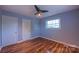 Bright bedroom has two closets, wood look flooring, a ceiling fan, and a window for natural light at 920 Thomas St, Statesville, NC 28677