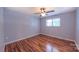 Relaxing bedroom with wood flooring, a ceiling fan, and one window providing natural light at 920 Thomas St, Statesville, NC 28677