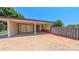 Spacious carport with convenient storage and a fenced area for added privacy at 920 Thomas St, Statesville, NC 28677