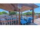 Relaxing covered deck area with comfortable seating overlooking the swimming pool and backyard at 920 Thomas St, Statesville, NC 28677