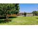 Charming single-story home with a well-manicured front lawn and mature landscaping at 920 Thomas St, Statesville, NC 28677