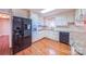 Spacious kitchen featuring white cabinetry, granite countertops, and stainless steel appliances at 920 Thomas St, Statesville, NC 28677