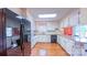 Well-lit kitchen featuring white cabinets, granite countertops, and stainless steel appliances at 920 Thomas St, Statesville, NC 28677