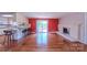 Spacious living room with brick fireplace, slider doors, and breakfast bar to kitchen at 920 Thomas St, Statesville, NC 28677