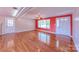 Bright living room features hardwood floors, a ceiling fan, with access to the front entrance at 920 Thomas St, Statesville, NC 28677