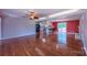 Open concept living room with hardwood floors leads to the kitchen and outdoor deck at 920 Thomas St, Statesville, NC 28677