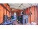 Interior view of the shed with lawn equipment, tools, and ample storage space at 920 Thomas St, Statesville, NC 28677