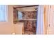 Walk-in shower with decorative tile surround and glass door, adjacent to a window at 920 Thomas St, Statesville, NC 28677