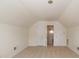 Bedroom featuring neutral carpet, walk-in closet, and a door that leads to another room at 1003 Grayscroft Dr, Waxhaw, NC 28173