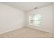 Bedroom with plush carpet, natural light and a view of the neighborhood at 1003 Grayscroft Dr, Waxhaw, NC 28173