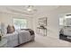 Bright bedroom with neutral colors, natural light, and attached bathroom at 1003 Grayscroft Dr, Waxhaw, NC 28173