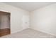 Bedroom with plush carpet, closet with double doors and attached bathroom at 1003 Grayscroft Dr, Waxhaw, NC 28173