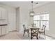 Bright breakfast nook featuring a round table with seating for four and ample natural light from a large window at 1003 Grayscroft Dr, Waxhaw, NC 28173