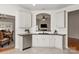Bright kitchen featuring white cabinets, stainless steel appliances, and an open view to the dining area at 1003 Grayscroft Dr, Waxhaw, NC 28173