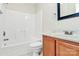 Full bathroom with a shower-tub combo, toilet, vanity, and framed mirror at 10032 Pergola View Ct, Charlotte, NC 28213