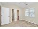 Bedroom featuring a window with natural light and a door to an ensuite bathroom at 10032 Pergola View Ct, Charlotte, NC 28213