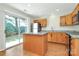Bright kitchen features an island, stainless steel appliances, and sliding glass door to backyard at 10032 Pergola View Ct, Charlotte, NC 28213