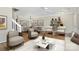 A spacious living room featuring hardwood floors and a ceiling fan at 10032 Pergola View Ct, Charlotte, NC 28213