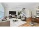 Stylishly furnished living room with a ceiling fan, a decorative rug, and modern décor at 10032 Pergola View Ct, Charlotte, NC 28213
