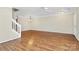 Large living room with hardwood floors and a ceiling fan at 10032 Pergola View Ct, Charlotte, NC 28213